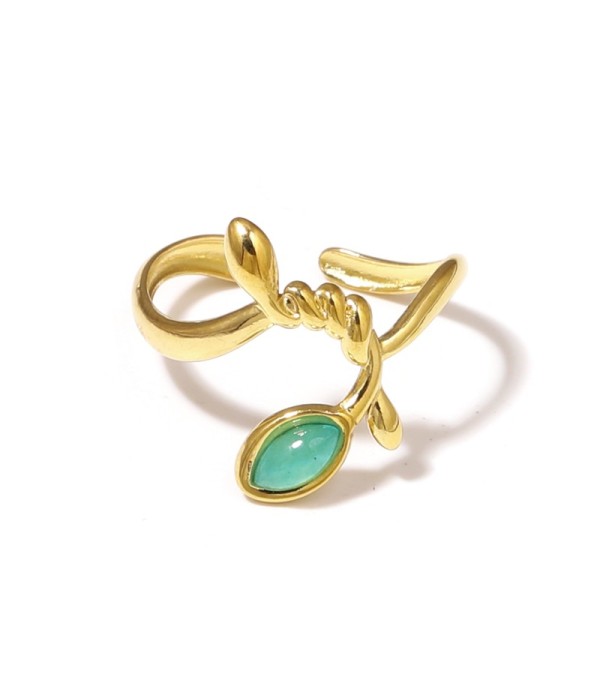 Anillo dorado con líneas entrelazadas y piedra