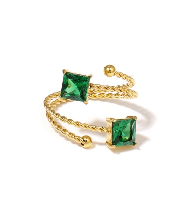 Anillo dorado con diseño de cordón y circonitas...