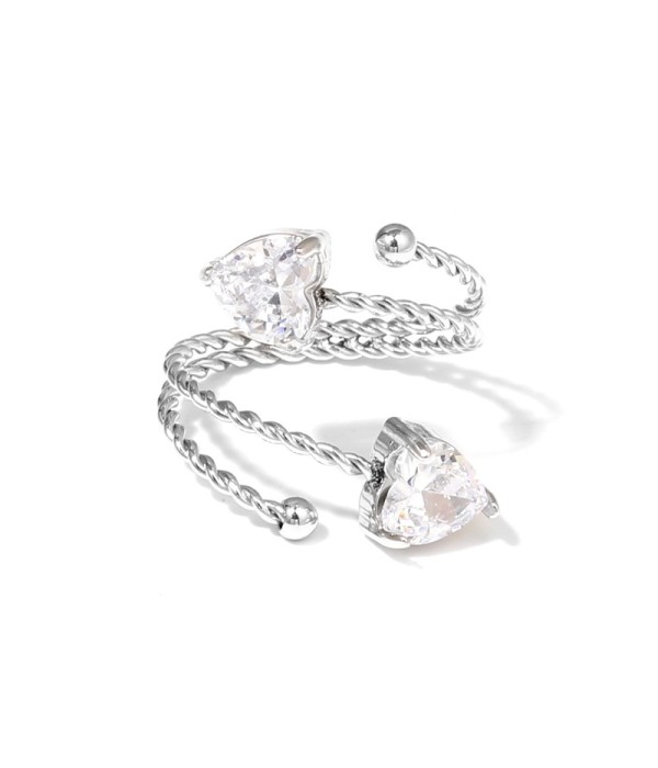Anillo plateado con diseño de cordón y circonitas en...