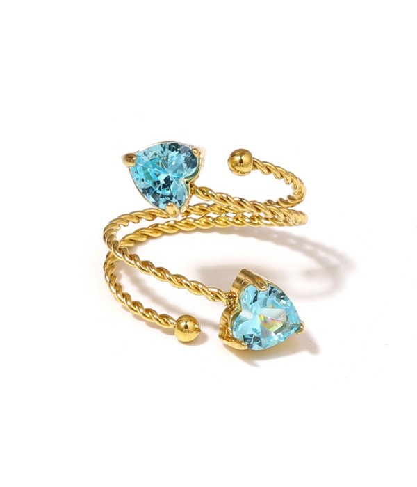 Anillo dorado con diseño de cordón y circonitas...