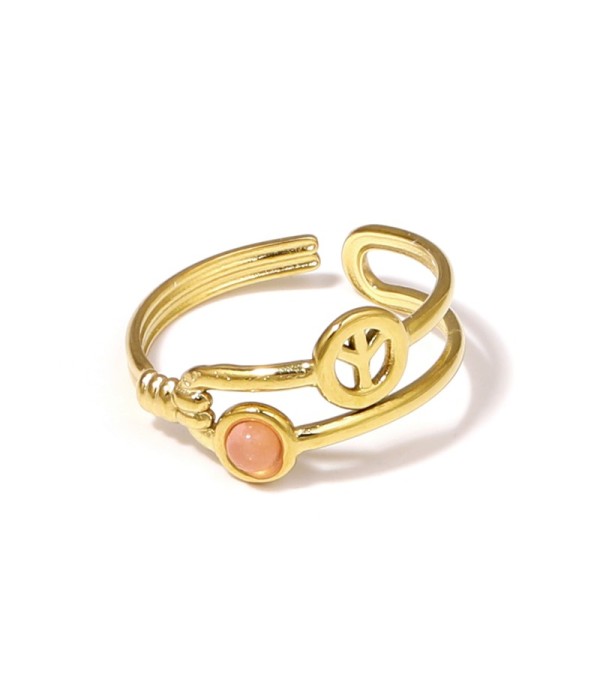 Anillo dorado con símbolo de la paz y piedra