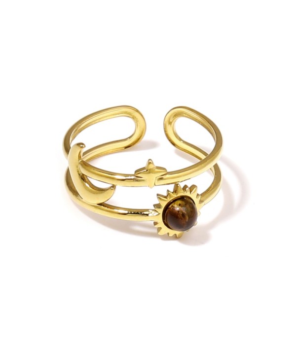 Anillo dorado de temática cósmica con piedra