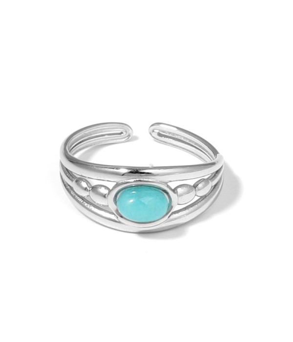 Anillo plateado con relieves ovalados y piedra...