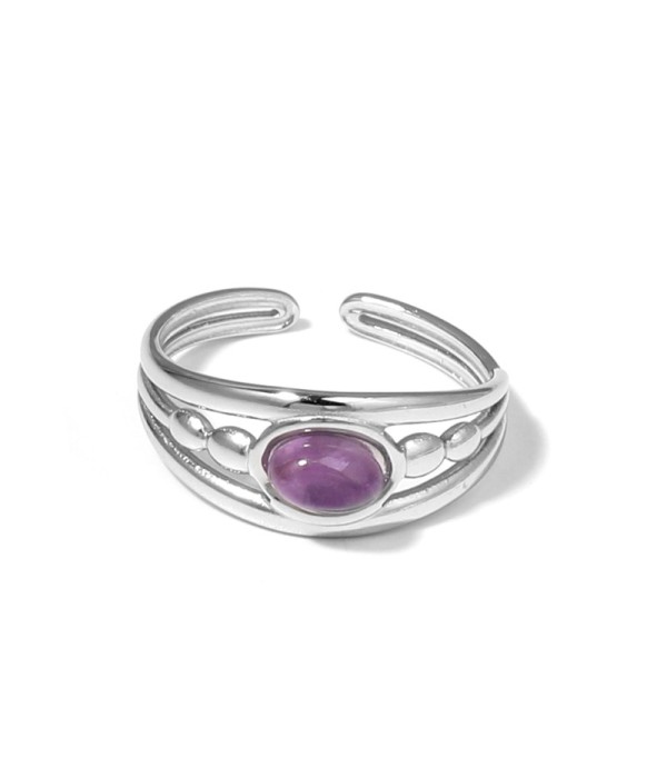 Anillo plateado con relieves ovalados y piedra...
