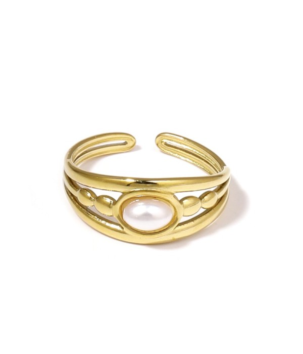 Anillo dorado con relieves ovalados y piedra ovalada