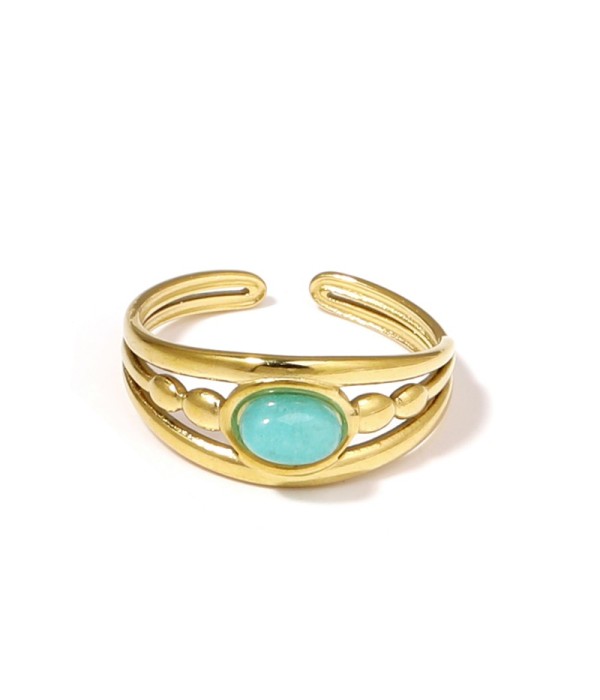 Anillo dorado con relieves ovalados y piedra...