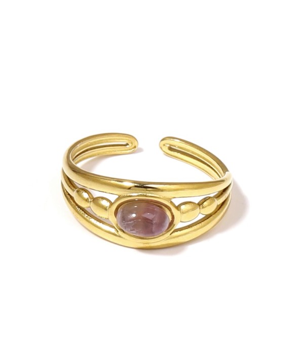 Anillo dorado con relieves ovalados y piedra ovalada