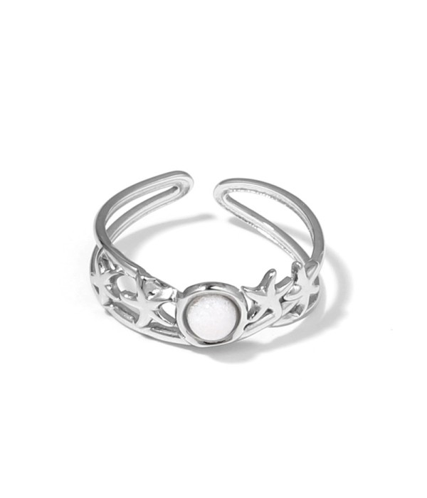 Anillo plateado con estrellas de mar y piedra