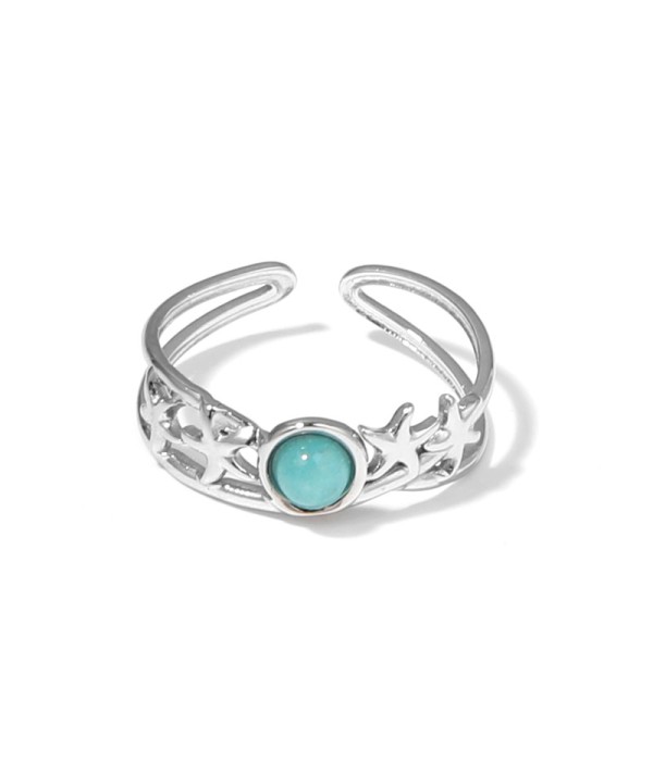 Anillo plateado con estrellas de mar y piedra