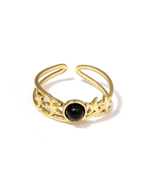 Anillo dorado con estrellas de mar y piedra