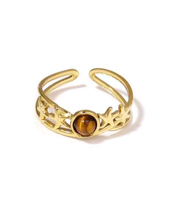 Anillo dorado con estrellas de mar y piedra