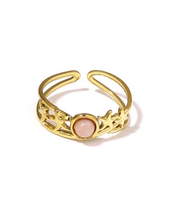 Anillo dorado con estrellas de mar y piedra
