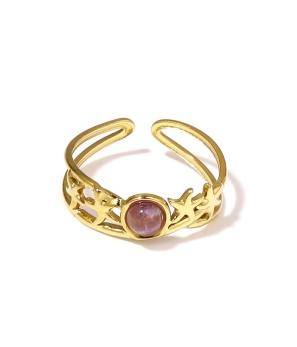 Anillo dorado con estrellas de mar y piedra