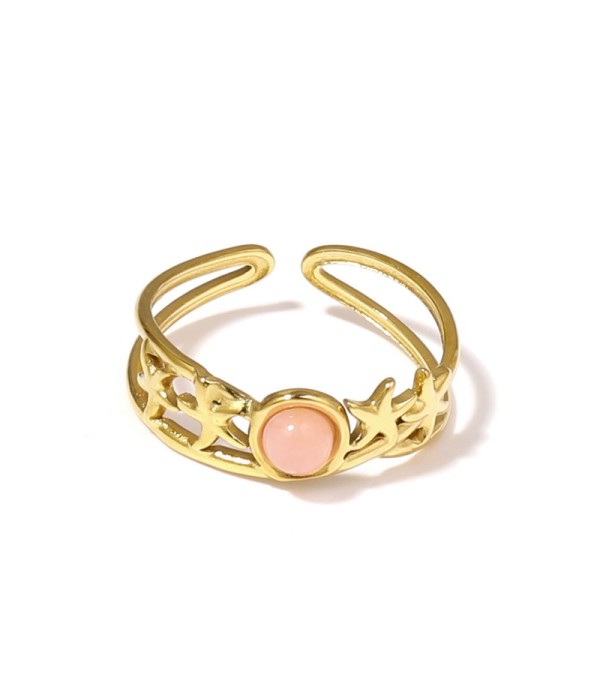 Anillo dorado con estrellas de mar y piedra