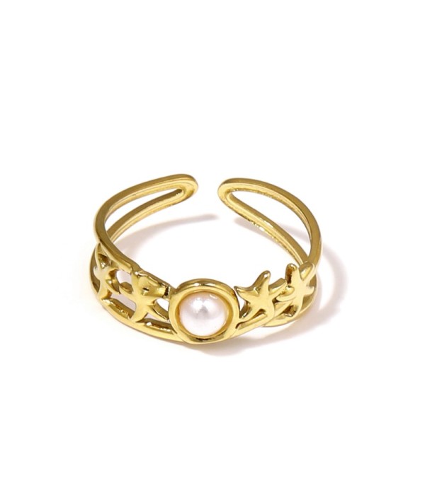 Anillo dorado con estrellas de mar y piedra