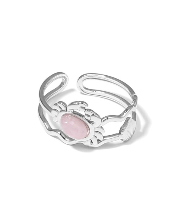 Anillo plateado con diseño de cangrejo, concha y piedra