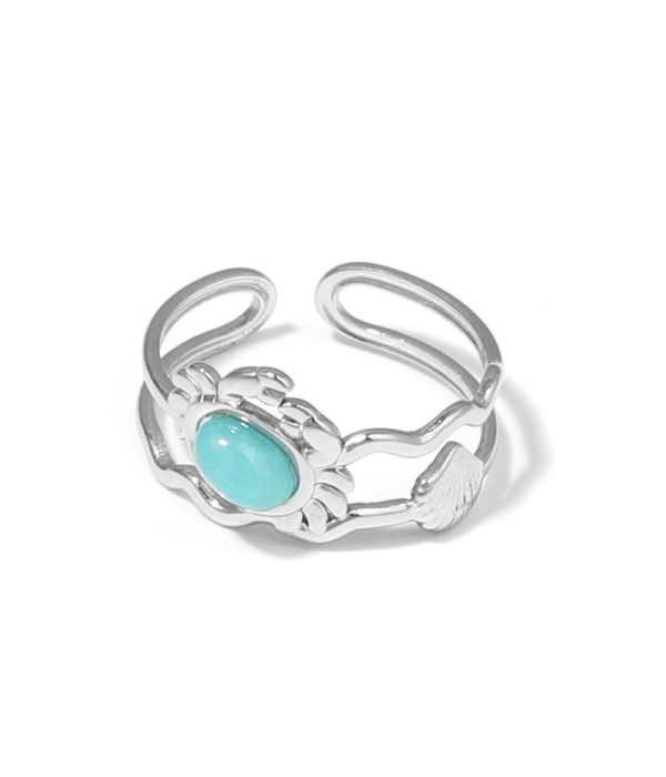 Anillo plateado con diseño de cangrejo, concha y piedra