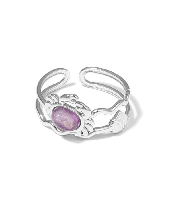 Anillo plateado con diseño de cangrejo, concha y piedra