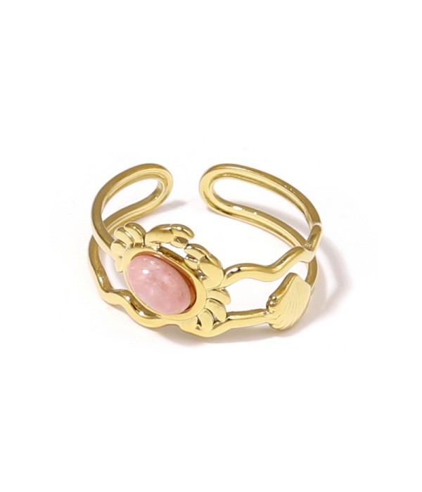 Anillo dorado con diseño de cangrejo, concha y piedra
