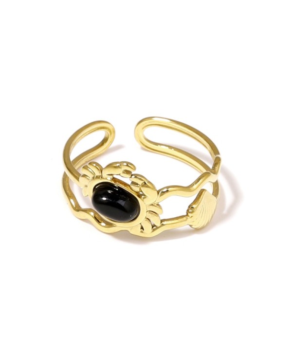 Anillo dorado con diseño de cangrejo, concha y piedra