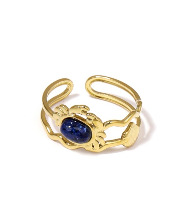Anillo dorado con diseño de cangrejo, concha y piedra