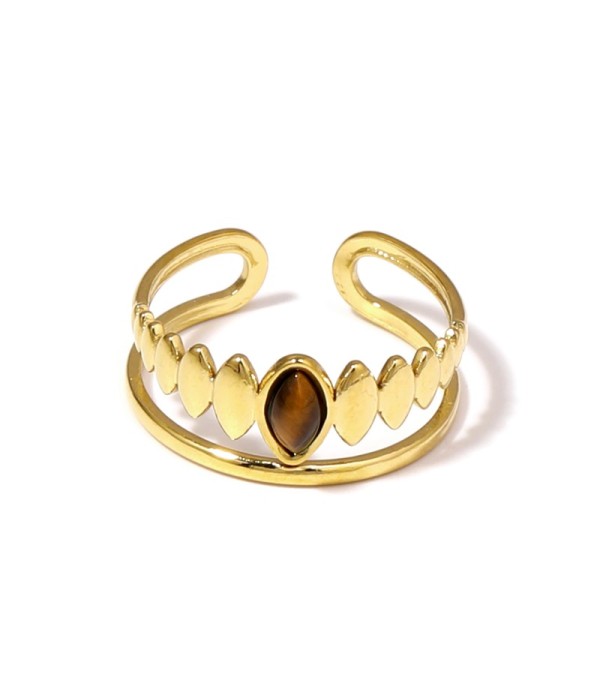 Anillo dorado con detalles ovalados y piedra...