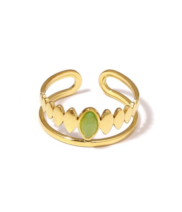 Anillo dorado con detalles ovalados y piedra...