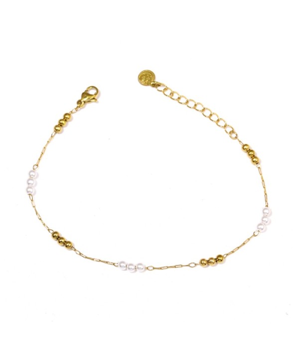 Pulsera dorada con perlas y detalles dorados