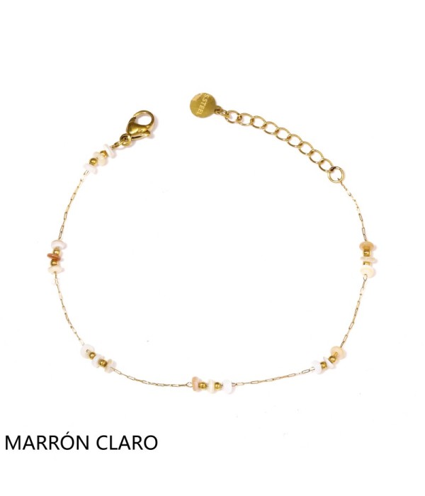 Pulsera dorada con cuentas planas y pequeñas...