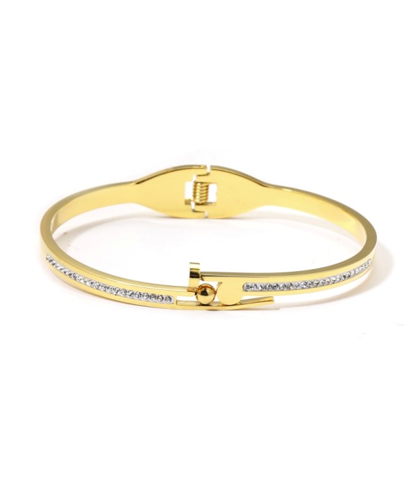 Pulsera rígida dorada con bandas alternadas detalladas con circonitas