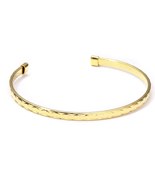 Pulsera rígida dorada abierta patronada
