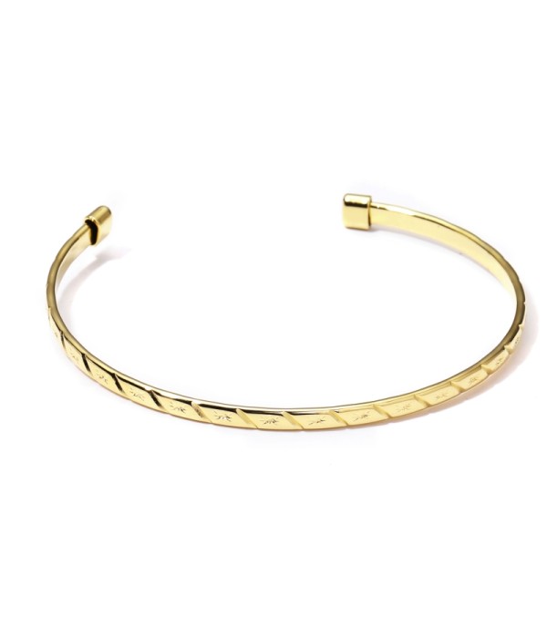 Pulsera rígida dorada abierta patronada