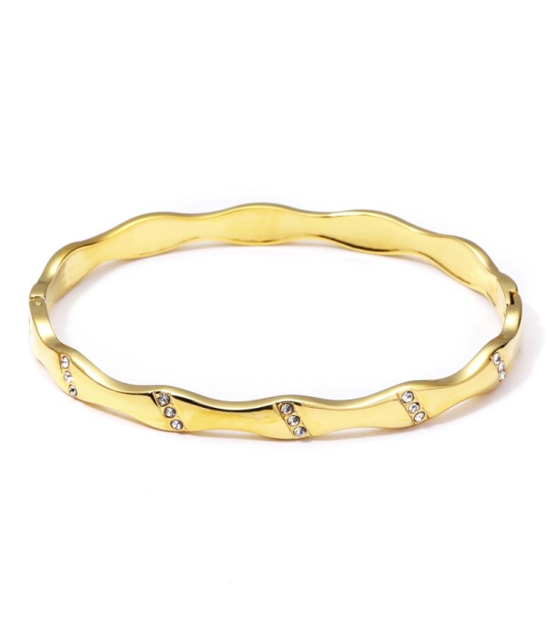 Pulsera rígida dorada abierta ondulada