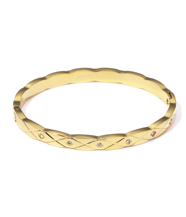 Pulsera rígida dorada tipo manguito con borde ondulado