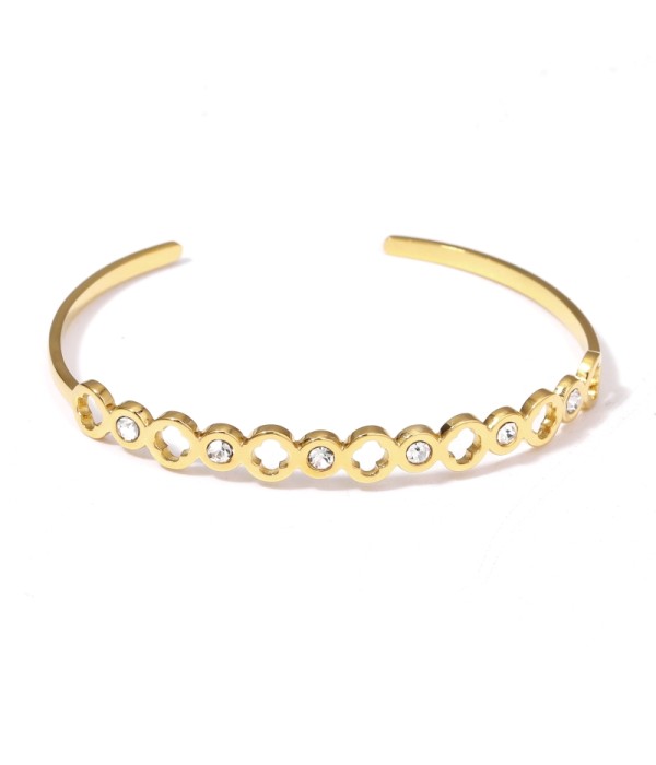 Pulsera rígida dorada con aros de círculos y circonitas