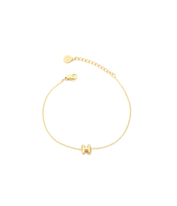 Pulsera dorada con colgante de letra H