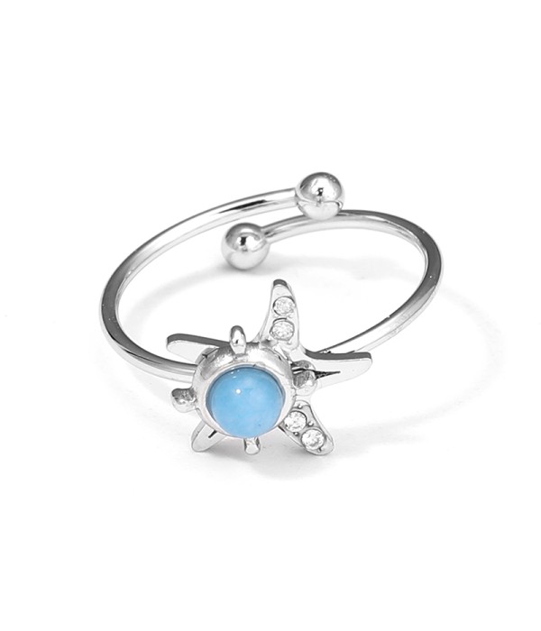 Anillo plateado de estrella marina con piedra