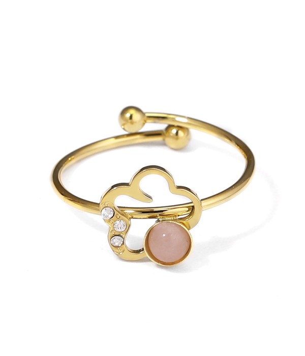 Anillo dorado con flor y piedra