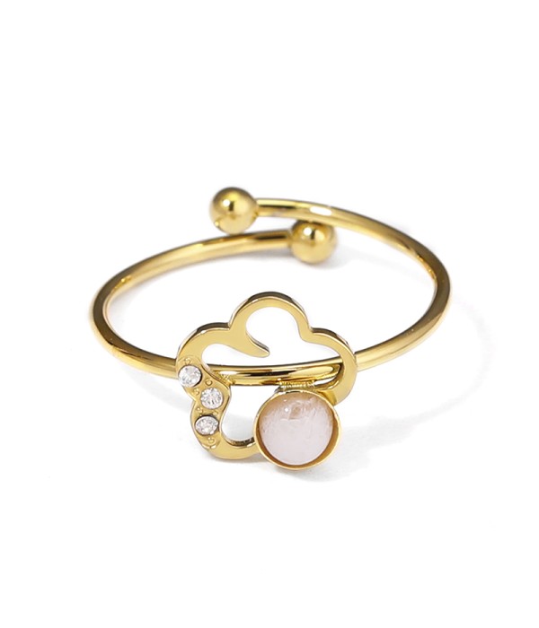 Anillo dorado con flor y piedra