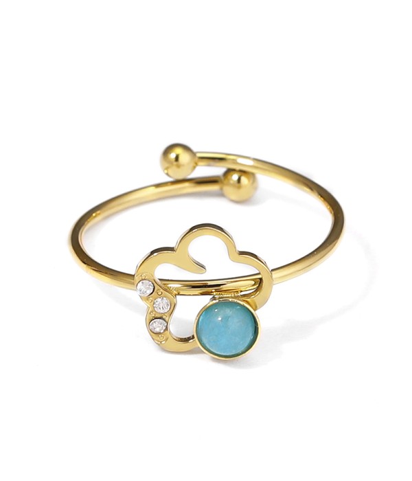 Anillo dorado con flor y piedra