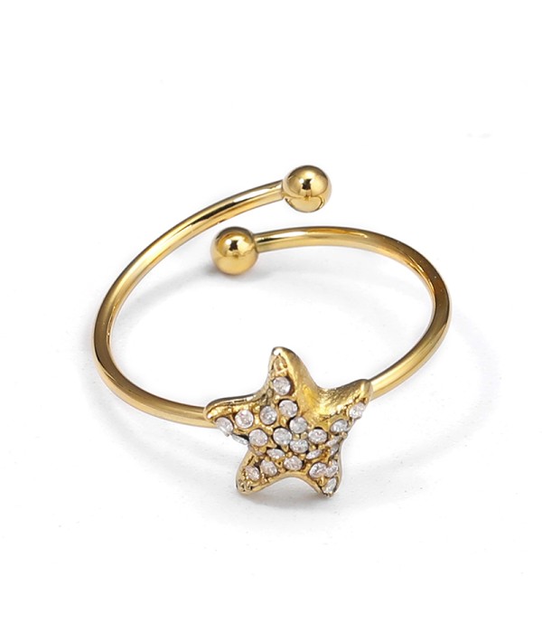Anillo dorado de estrella marina con circonitas