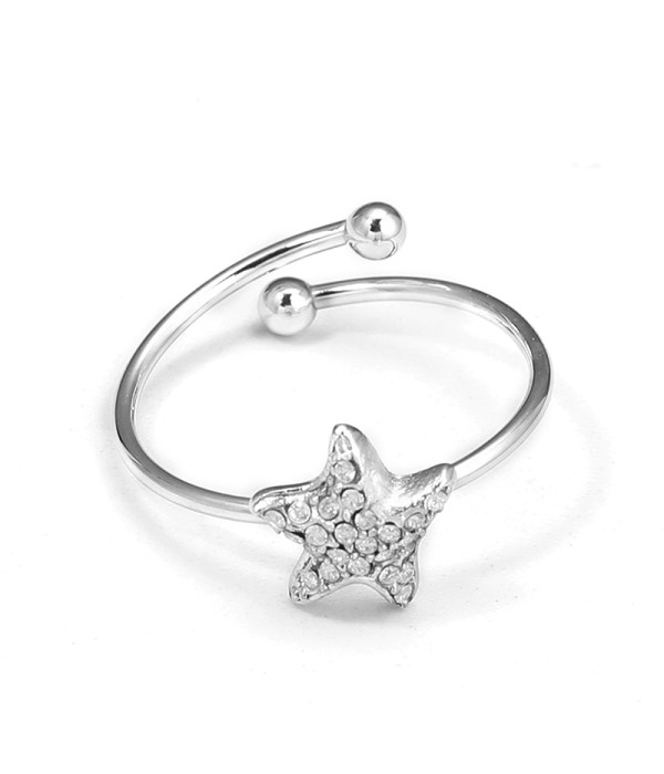 Anillo plateado de estrella marina con circonitas