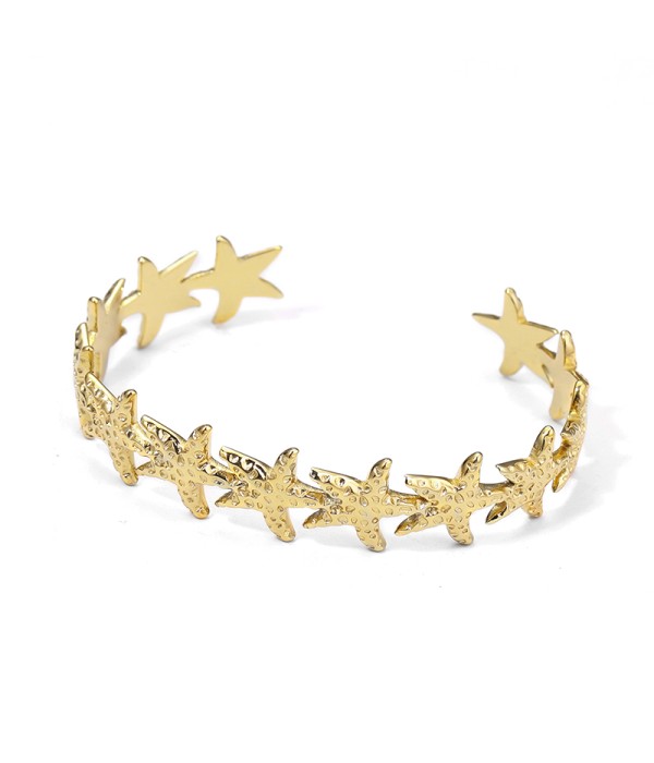 Pulsera rígida dorada con estrellas de mar