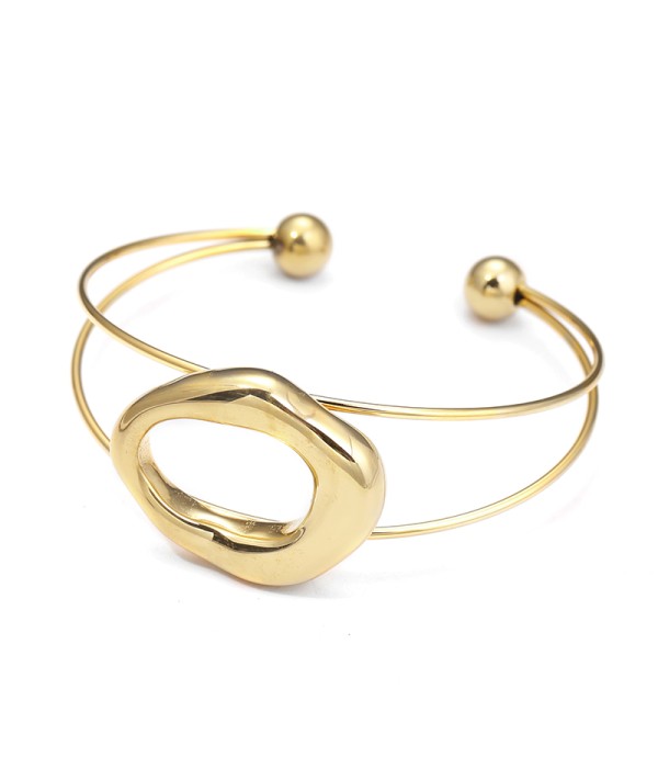 Brazalete dorada abierta con figura orgánica