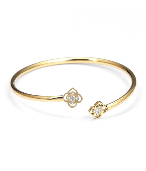 Pulsera rígida dorada con flores caladas y circonitas