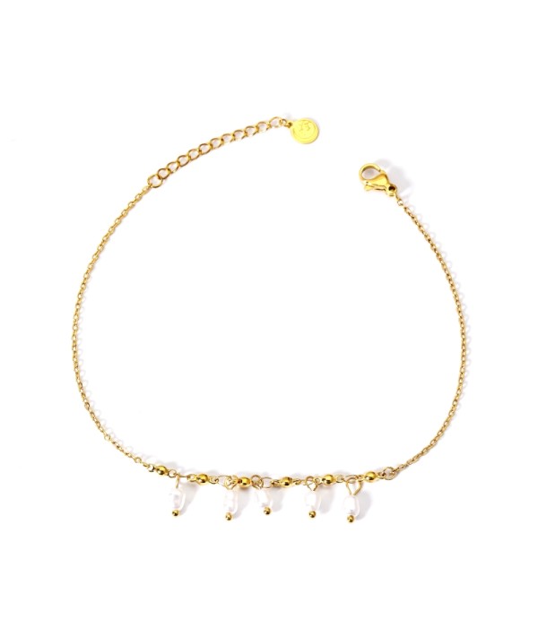 Tobillera dorada con perlas y detalles colgantes