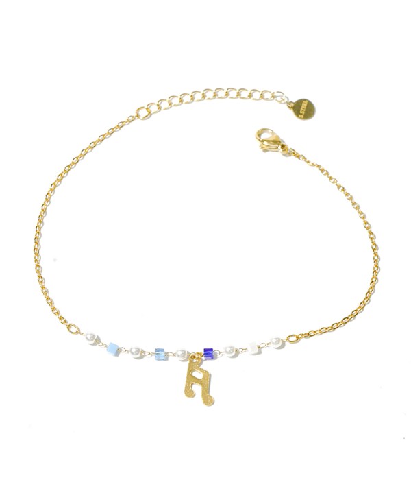 Tobillera dorada con nota musical y cuentas azules